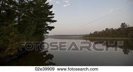 Shoreline at twilight in Lake of the Woods, Ontario View Large Photo Image Stock Photo - Shoreline at twilight in Lake of the Woods, Ontario. Fotosearch