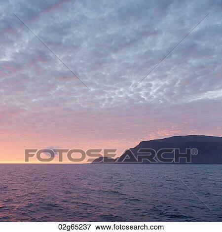 Silhouette of an island in the Pacific Ocean, Isabela Island, Galapagos Islands, Ecuador View Large Photo Image Stock Photo - Silhouette of an island in the Pacific Ocean, Isabela Island, Galapagos Islands, Ecuador. Fotosearch