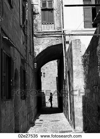 Stock Photography - Silhouette of woman in Rhodes Greece. Fotosearch