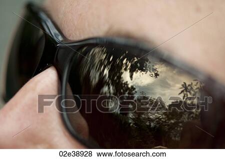 Sky and forest reflected in lenses of black sunglasses View Large Photo Image Stock Photo - Sky and forest reflected in lenses of black sunglasses. Fotosearch