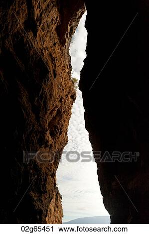 Sky viewed through the slot between two cliffs, Tagus Cove, Isabela Island, Galapagos Islands, Ecuador View Large Photo Image Stock Image - Sky viewed through the slot between two cliffs, Tagus Cove, Isabela Island, Galapagos Islands, Ecuador. Fotosearch