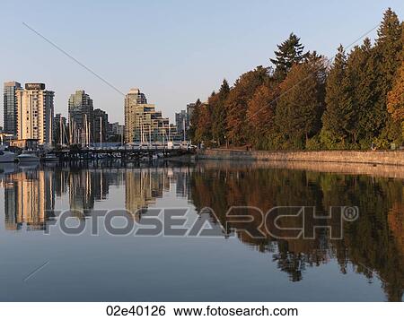 Skyline and reflection in Vancouver, British Columbia, Canada View Large Photo Image Stock Photograph - Skyline and reflection in Vancouver, British Columbia, Canada. Fotosearch