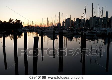 Stock Photograph - Skyline at dusk in Vancouver, British Columbia, Canada. Fotosearch