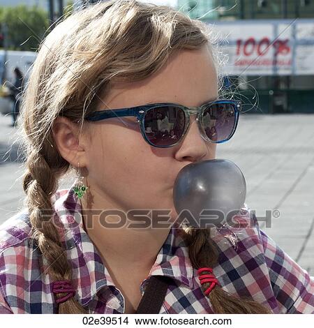 Smiling girl in sunglasses and casual chequered shirt View Large Photo Image Picture - Smiling girl in sunglasses and casual chequered shirt. Fotosearch