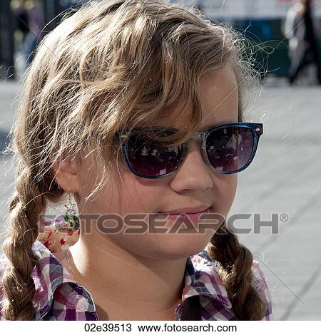 Smiling girl in sunglasses and casual chequered shirt View Large Photo Image Stock Image - Smiling girl in sunglasses and casual chequered shirt. Fotosearch