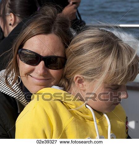 Smiling mother and child cuddling View Large Photo Image Stock Photo - Smiling mother and child cuddling. Fotosearch