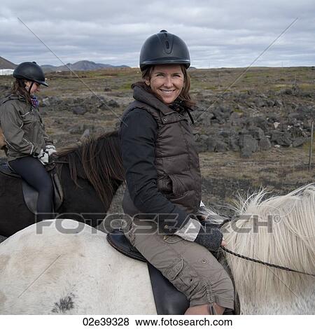 Smiling woman on horseback View Large Photo Image Stock Photo - Smiling woman on horseback. Fotosearch