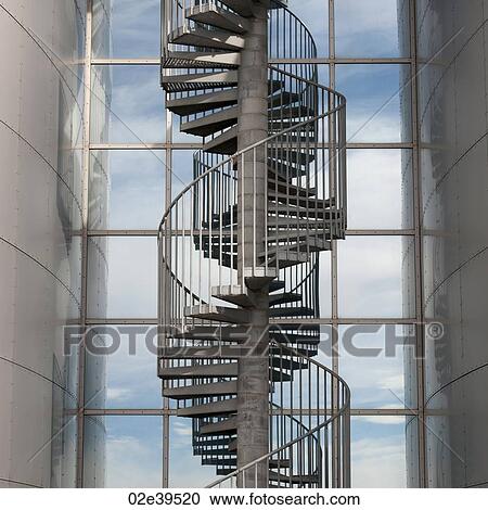 Spiral staircase before window panes View Large Photo Image Stock Image - Spiral staircase before window panes . Fotosearch