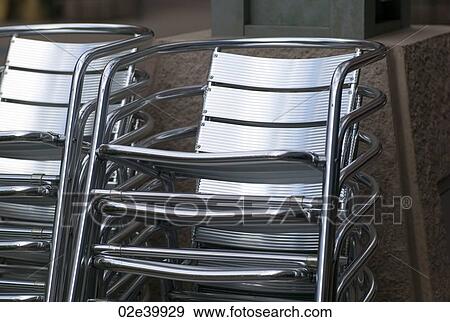 Stack of metal chairs in Rochester, Minnesota, USA View Large Photo Image Stock Photo - Stack of metal chairs in Rochester, Minnesota, USA. Fotosearch