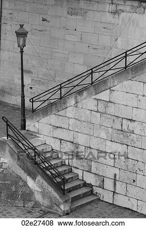 Stairway to riverbank in Paris France View Large Photo Image Stock Photo - Stairway to riverbank in Paris France. Fotosearch