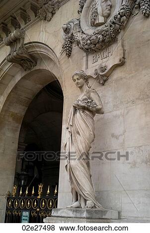 Stock Photo - Statue adorning the Palace Garnier in Paris France. Fotosearch