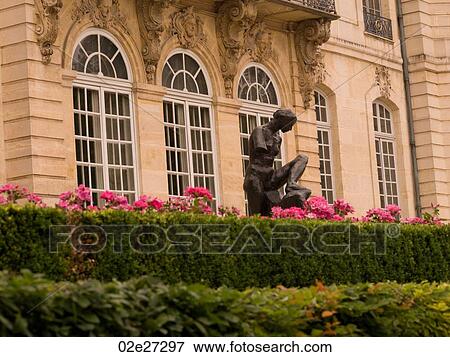 Stock Photo - Statue in front of building in Paris France. Fotosearch