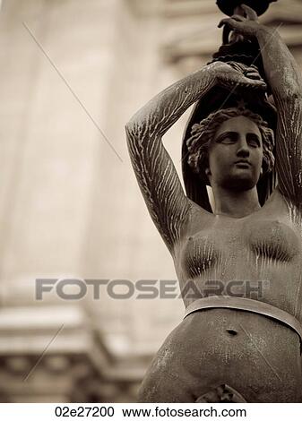 Stock Image - Statue Lamp Posts outside Palais Garnier in Paris France. Fotosearch