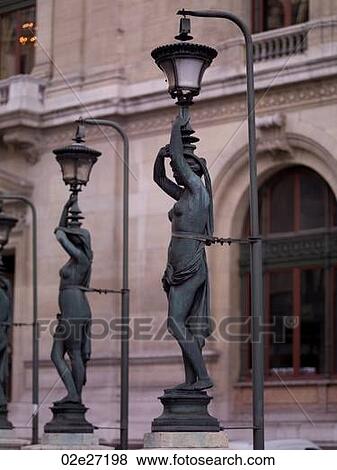 Statue Lamp Posts outside Palais Garnier in Paris France View Large Photo Image Stock Photo - Statue Lamp Posts outside Palais Garnier in Paris France. Fotosearch