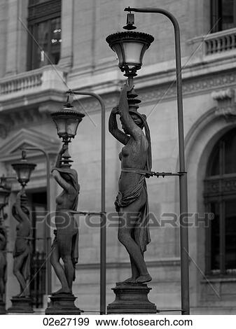 Stock Photo - Statue Lamp Posts outside Palais Garnier in Paris France. Fotosearch