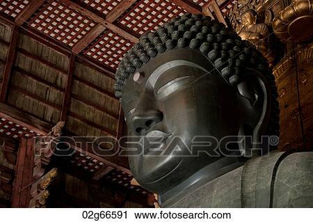 Stock Image - Statue of Buddha in Todaiji Temple, Nara, Japan. Fotosearch