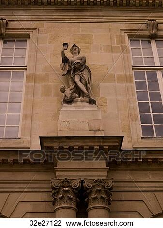 Stock Image - Statue on Exterior of building in Paris France. Fotosearch