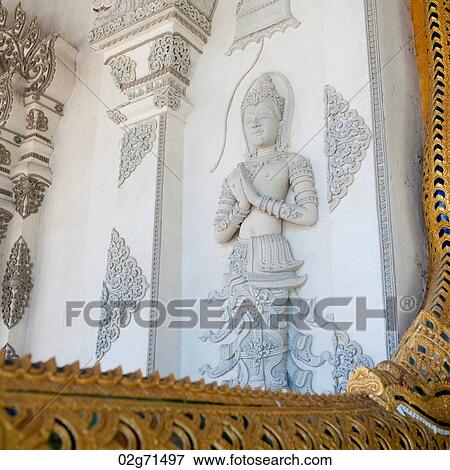 Stock Photo - Statue the wall of Wat Phra Singh, Chiang Mai, Thailand. Fotosearch