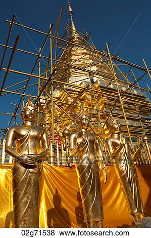 Statues of Buddha in front of a pagoda under renovation at Wat Phrathat Doi Suthep, Chiang Mai, Thailand View Large Photo Image Stock Photo - Statues of Buddha in front of a pagoda under renovation at Wat Phrathat Doi Suthep, Chiang Mai, Thailand. Fotosearch