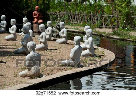 Statues of monks along a pond in Wat Horcome, Chiang Mai, Thailand View Large Photo Image Stock Image - Statues of monks along a pond in Wat Horcome, Chiang Mai, Thailand. Fotosearch