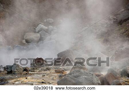 Steam rising from boulders strewn landscape View Large Photo Image Stock Photo - Steam rising from boulders strewn landscape. Fotosearch
