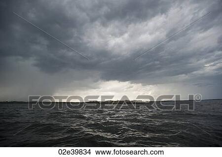 Storm clouds in the horizon sky at Lake of the Woods, Ontario View Large Photo Image Picture - Storm clouds in the horizon sky at Lake of the Woods, Ontario. Fotosearch