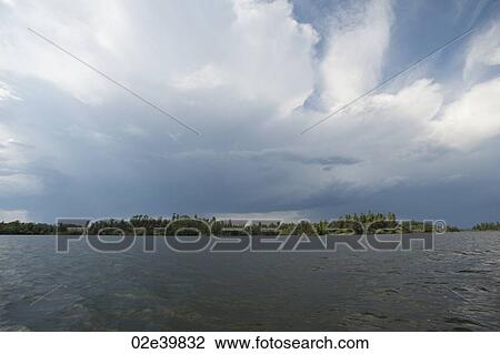 Storm clouds in the horizon sky at Lake of the Woods, Ontario View Large Photo Image Stock Image - Storm clouds in the horizon sky at Lake of the Woods, Ontario. Fotosearch
