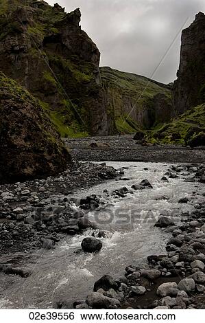 Stream at the bottom of a revine in Iceland View Large Photo Image Stock Photograph - Stream at the bottom of a revine in Iceland. Fotosearch