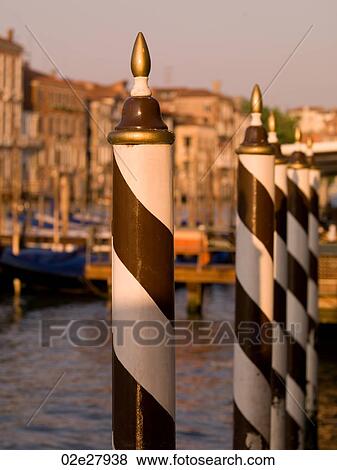 Stock Photo - Striped poles in Venice. Fotosearch