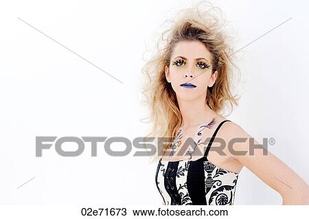 Stock Image - Studio shot of a glamorous woman against a white background. Fotosearch