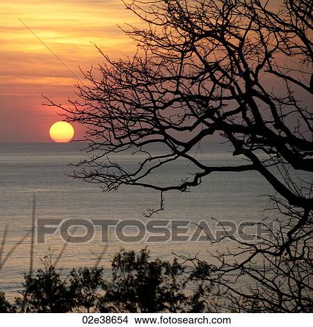 Picture - Sunset over Costa Rica coastal waters. Fotosearch