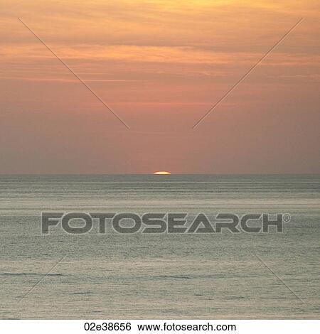 Stock Photograph - Sunset over Costa Rica coastal waters. Fotosearch