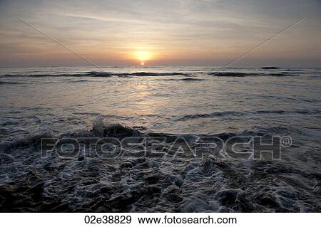 Stock Photo - Sunset over the beach at Costa Rica with cool overtones. Fotosearch