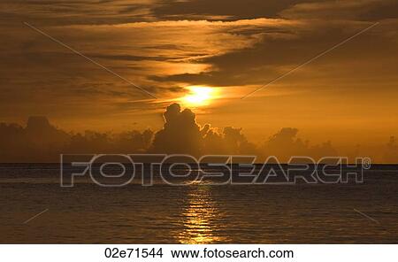 Picture - Sunset over water. Fotosearch