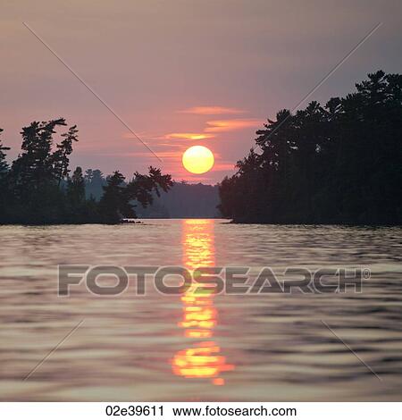 Sunset sky at Lake of the Woods, Ontario View Large Photo Image Stock Image - Sunset sky at Lake of the Woods, Ontario. Fotosearch