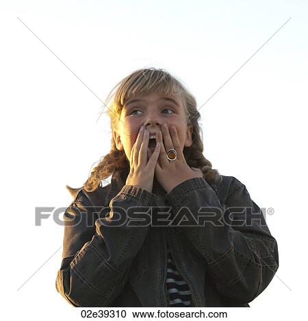 Surprised girl in evening sunlight View Large Photo Image Stock Image - Surprised girl in evening sunlight. Fotosearch