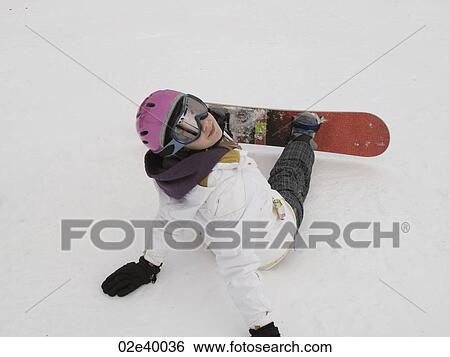 Teenage girl sitting in the snow on a ski slope of Vail Colorado View Large Photo Image Stock Photograph - Teenage girl sitting in the snow on a ski slope of Vail Colorado. Fotosearch