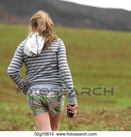 Teenage girl walking in a field, Sacred Valley, Cusco Region, Peru View Large Photo Image Picture - Teenage girl walking in a field, Sacred Valley, Cusco Region, Peru. Fotosearch