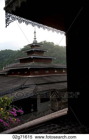 Stock Photography - Temple viewed from a window, Thailand. Fotosearch