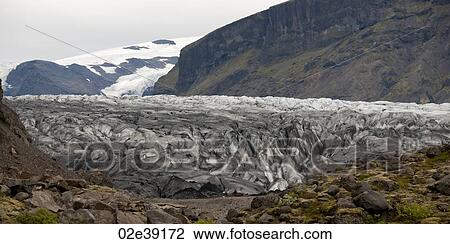 Terminus of glacier through mountain valley View Large Photo Image Stock Image - Terminus of glacier through mountain valley. Fotosearch