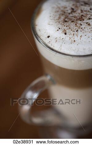 Three layer frothy coffee in a glass mug View Large Photo Image Stock Image - Three layer frothy coffee in a glass mug. Fotosearch