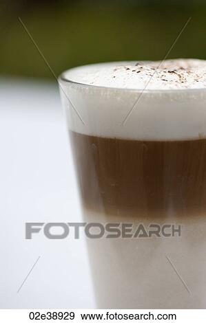 Three layer frothy coffee in a glass mug View Large Photo Image Stock Photo - Three layer frothy coffee in a glass mug. Fotosearch