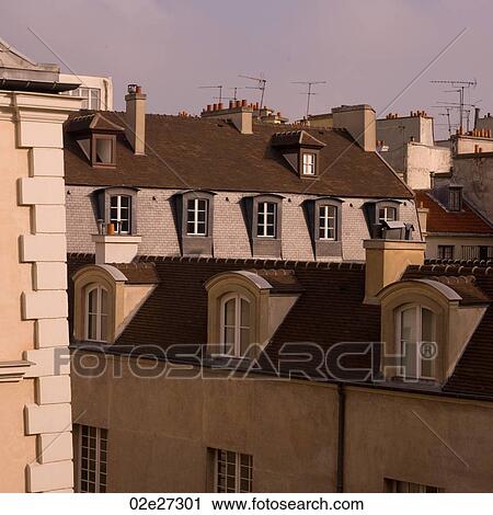 Stock Image - Tops of buildings in Paris France. Fotosearch