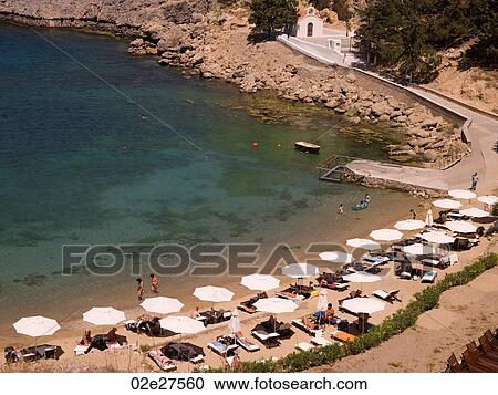 Umbrellas on beach in Rhodes Greece View Large Photo Image Stock Image - Umbrellas on beach in Rhodes Greece. Fotosearch