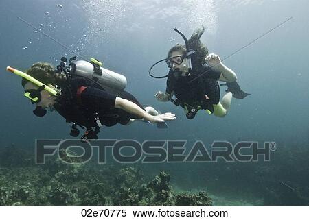 Stock Photography - Underwater scene with scuba divers. Fotosearch