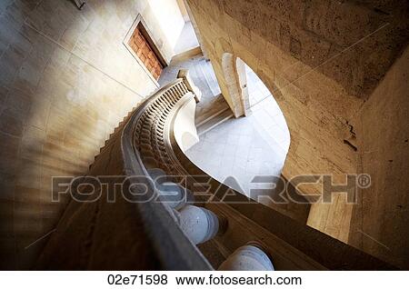 Stock Photo - View down a curved staircase. Fotosearch