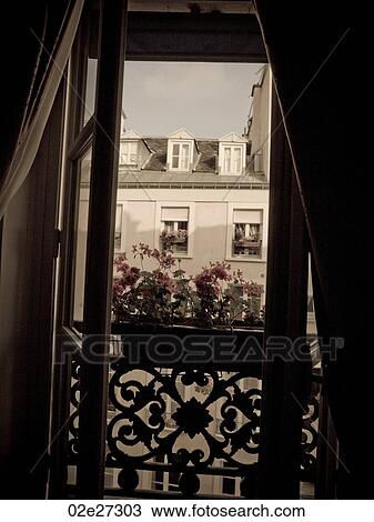 Stock Image - View of building through window in Paris France. Fotosearch