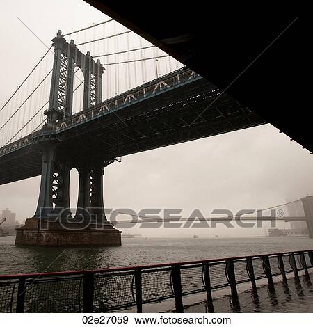 Stock Photo - View of the Manhattan Bridge in Manhattan, New York City, U. S. A.. Fotosearch