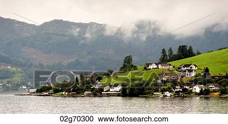 Village at waterfront, Hardanger, Hardangerfjord, Hardangervidda, Hardanger, Norway View Large Photo Image Stock Image - Village at waterfront, Hardanger, Hardangerfjord, Hardangervidda, Hardanger, Norway. Fotosearch