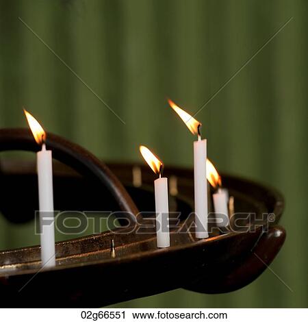 Stock Image - Votive candles burning in Todaiji Temple, Nara, Japan. Fotosearch